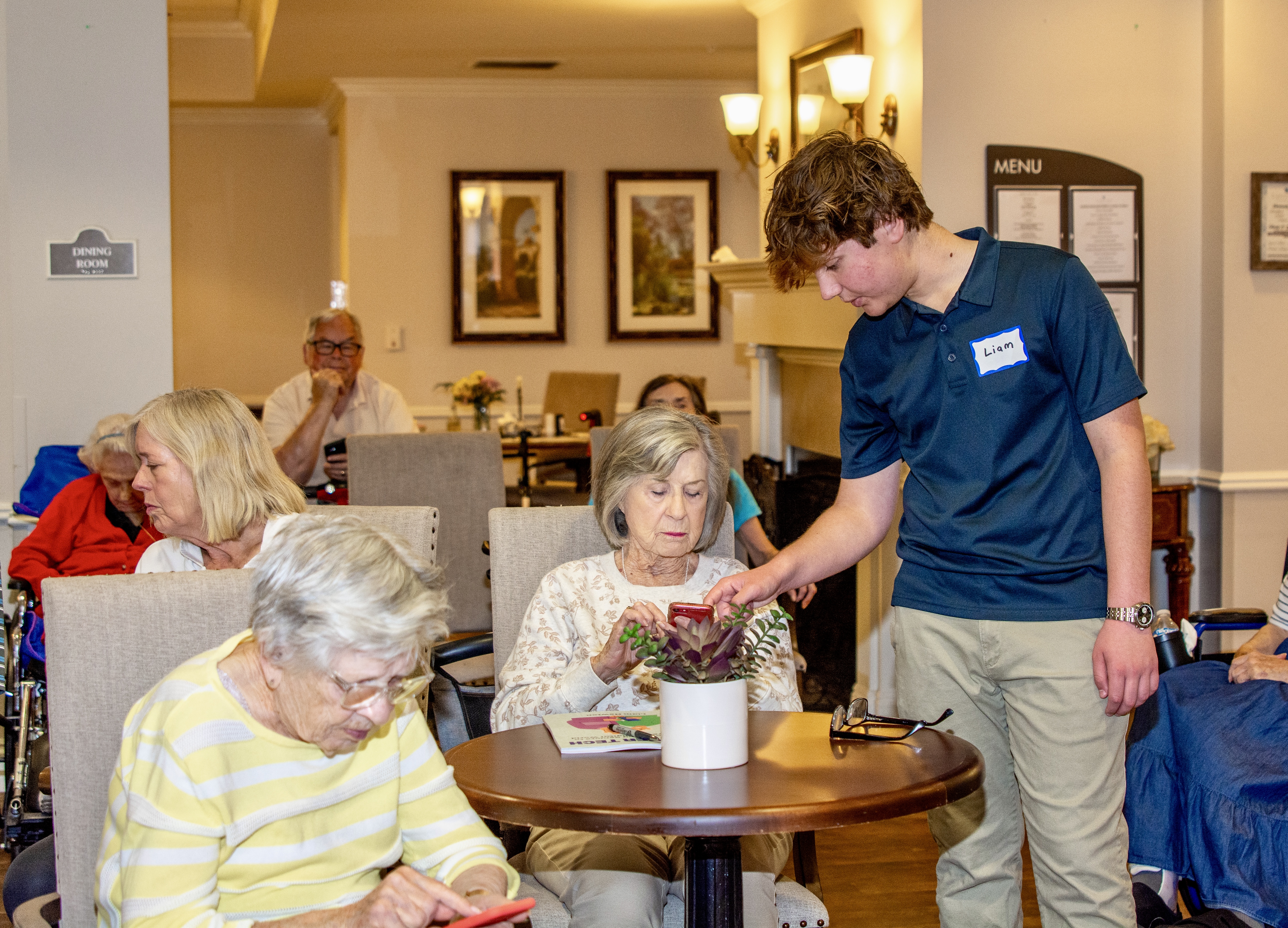 Liam helping seniors at class